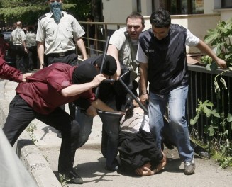 Georgian police detain an opposition protestor in Tbilisi