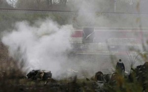 A French gendarme searches the wreckage of a test TGV train that derailed and crashed in a canal outside Eckwersheim near Strasbourg, eastern France, November 14, 2015. REUTERS/Vincent Kessler