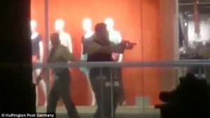 368332C400000578-3703789-The_police_officers_inside_the_shopping_mall_cover_each_other_an-m-50_1469218349528