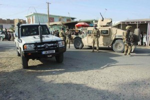 Afghan security forces keep watch in front of their armoured vehicle in Kunduz city, Afghanistan October 4, 2016.REUTERS/Nasir Wakif