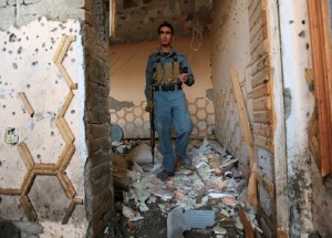 An Afghan police inspects a house after a suicide attack at an elders meeting gathering on the outskirts of Jalalabad city, Afghanistan October 31, 2016.REUTERS/Parwiz