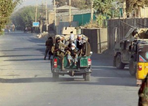 Afghan Local Police (ALP) forces sit on the back of a police pickup in Kunduz city, Afghanistan October 4, 2016.REUTERS/Nasir Wakif