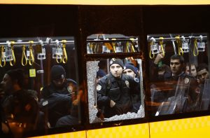 epaselect epa05669806 Police officers stand inside a damaged bus after an explosion around Vodafone Arena Stadium in Istanbul, Turkey, 10 December 2016. At least 20 people were wounded in what the Interior Ministry called a car bomb attack after two explosions were heard outside Besiktas Stadium a few hours after the night's soccer match. EPA/SEDAT SUNA