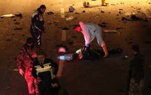 epa05670015 Crime scene investigators inspect a police officer's body at the scene after an explosion around Vodafone Arena Stadium in Istanbul, Turkey, 10 December 2016. According to security source at least 13 people were killed in what the Interior Ministry called a car bomb attack after two explosions were heard outside Besiktas Stadium a few hours after the night's soccer match. EPA/SEDAT SUNA ATTENTION EDITORS: PICTURE CONTAINS GRAPHIC CONTENT