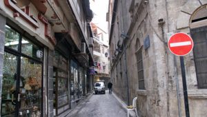 A man walks past shops in al-Jdeideh neighborhood, in the Old City of Aleppo, Syria December 12, 2009. REUTERS/Khalil Ashawi