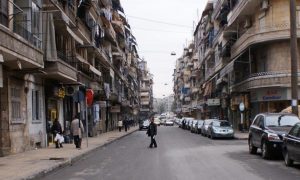 A man crosses a street in Aleppo, Syria December 12, 2009. REUTERS/Khalil Ashawi