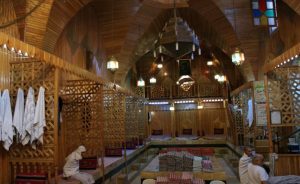 Customers, covered in towels, rest after taking a bath at the historical Hamam El Nahasin, in the Old City of Aleppo, Syria October 6, 2010. REUTERS/Khalil Ashawi