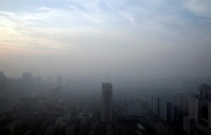 Buildings are seen in smog on a polluted day as a red alert for air pollution is issued in Beijing, China, December 16, 2016. REUTERS/Jason Lee