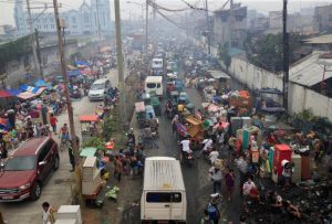 Fire victims gathers along a street after a fire destroyed more than hundreds of shanties at a community of informal settlers, according to authorities, in Parola Compound, Tondo city, metro Manila, Philippines February 8, 2017. REUTERS/Romeo Ranoco