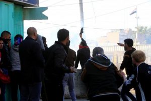 Iraqi security forces fire tear gas after supporters of Iraqi Shi'ite cleric Moqtada al-Sadr tried to approach the heavily fortified Green Zone during a protest at Tahrir Square in Baghdad,Iraq February 11, 2017. REUTERS /Alaa Al-Marjani